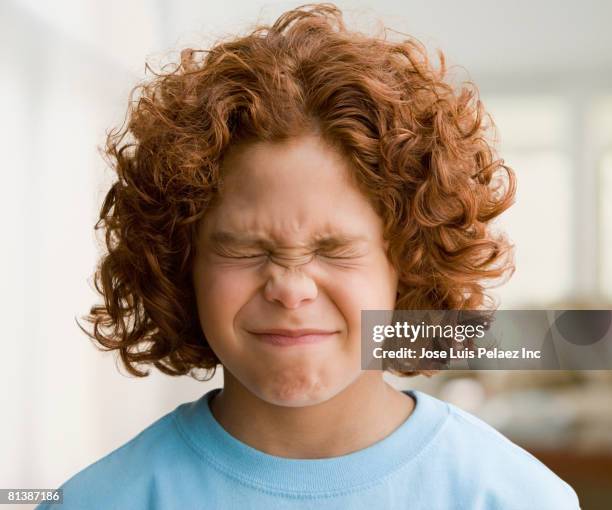 mixed race boy with eyes closed tightly - child eyes closed stock pictures, royalty-free photos & images