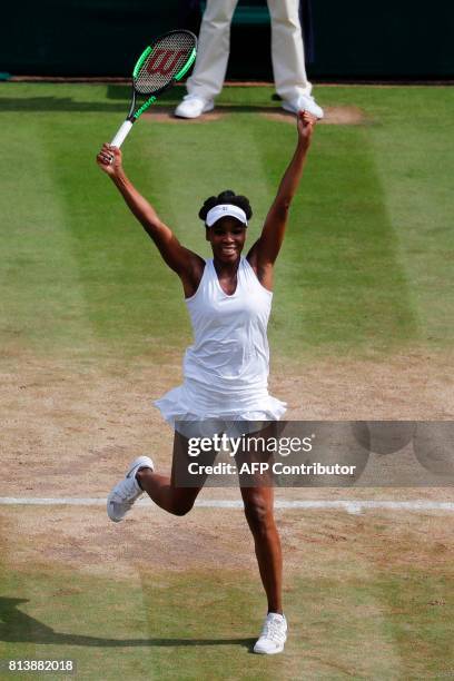 Player Venus Williams reacts after winning against Britain's Johanna Konta during their women's singles semi-final match on the tenth day of the 2017...