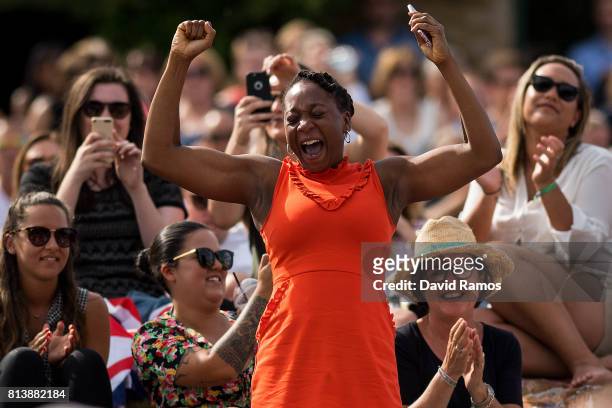 Venus Williams' supporter reacts as she watches the action on the screen from 'Murray Mound' during the Ladies Singles semi final match between...