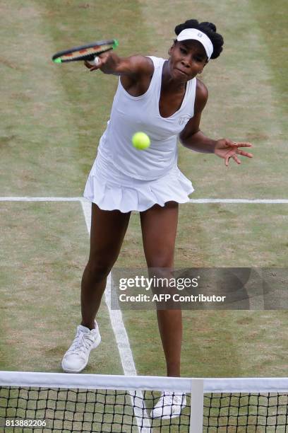 Player Venus Williams returns against Britain's Johanna Konta during their women's singles semi-final match on the tenth day of the 2017 Wimbledon...