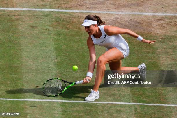 Britain's Johanna Konta returns against US player Venus Williams during their women's singles semi-final match on the tenth day of the 2017 Wimbledon...