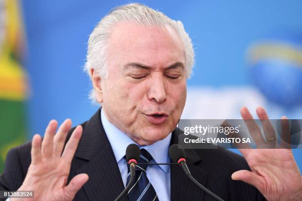 Brazilian President Michel Temer delivers a speech during a public health investment announcement event at Planalto Palace in Brasilia on July 13,...