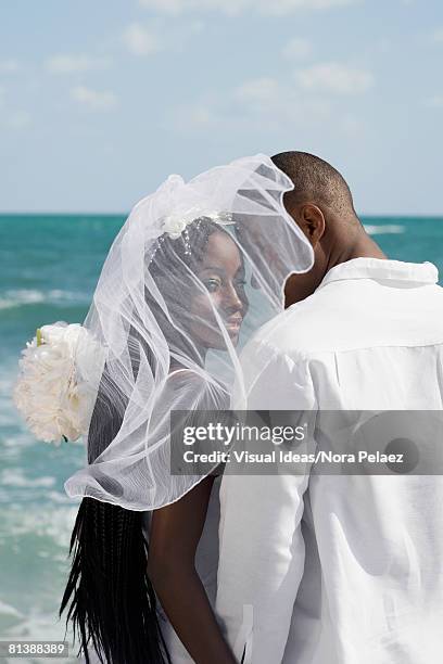 african bride and groom at beach - veil stock pictures, royalty-free photos & images