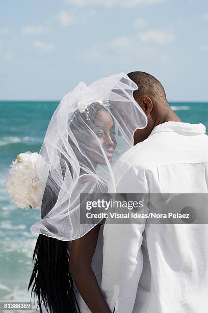 african bride and groom at beach - bride veil stock pictures, royalty-free photos & images