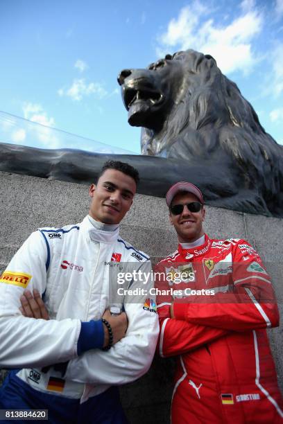 Sebastian Vettel of Germany and Ferrari and Pascal Wehrlein of Germany and Sauber F1 during F1 Live London at Trafalgar Square on July 12, 2017 in...