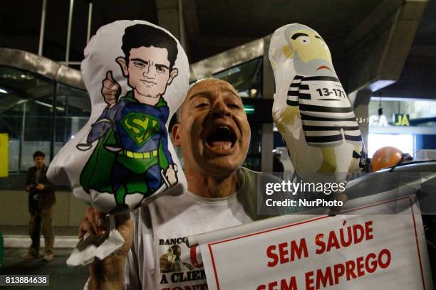 Protesters protest against the conviction of former President Luiz Inacio Lula da Silva on Avenida Paulista, central region of Sao Paulo, Brazil, on...