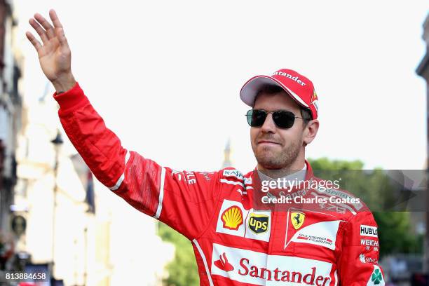 Sebastian Vettel of Germany and Ferrari waves to the crowd during F1 Live London at Trafalgar Square on July 12, 2017 in London, England. F1 Live...