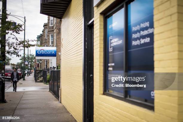 Pedestrian walks past a Citigroup Inc. Bank branch in Chicago, Illinois, U.S., on Wednesday, July 12, 2017. Citigroup Inc. Is scheduled to release...