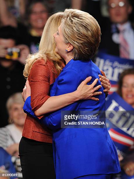 Democratic presidential hopeful and New York Senator Hillary Rodham Clinton gets a hug from daughter Chelsea Clinton during her election night event...