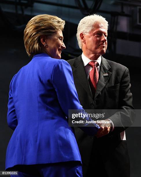 Former U.S. President Bill Clinton and his wife, Democratic presidential hopeful Hillary Clinton , greet supporters at the final primary night party...