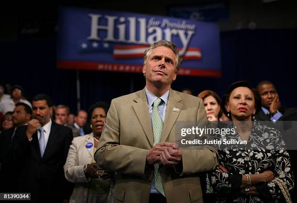 Terry McAuliffe, campaign chairman for Democratic presidential hopeful Hillary Clinton, looks on as she Clinton speaks to supporters at the final...