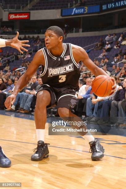 Ryan Gomes of the Providence Friars dribbles the ball during a college basketball game against the Georgetown Hoyas at MCI Center on February 25,...