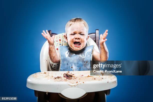 cute messy baby covered in food - toddler crying stock pictures, royalty-free photos & images