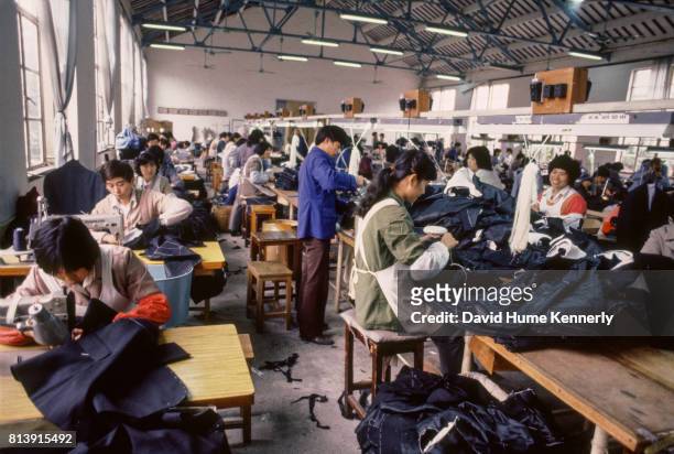 People make clothes at a factory, Beijing, China, 1985.