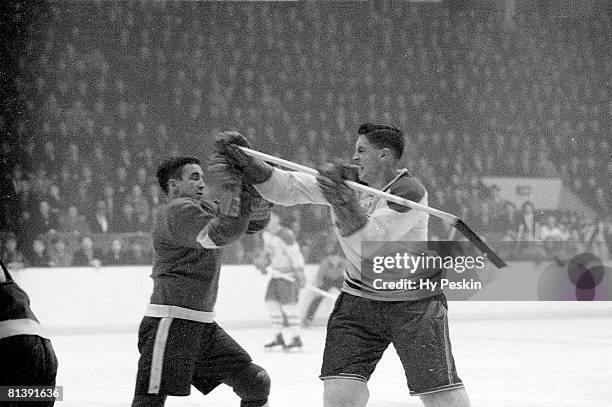 Hockey: Montreal Canadiens Jean Beliveau in action vs Detroit Red Wings Ted Lindsay during fight, Montreal, CAN 2/17/1955