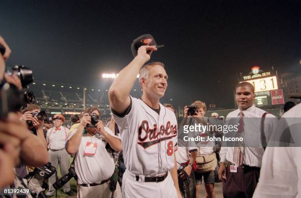 Baseball: Baltimore Orioles Cal Ripken Jr, victorious, on field after breaking Lou Gehrig's 2130 game record during game vs California Angels,...