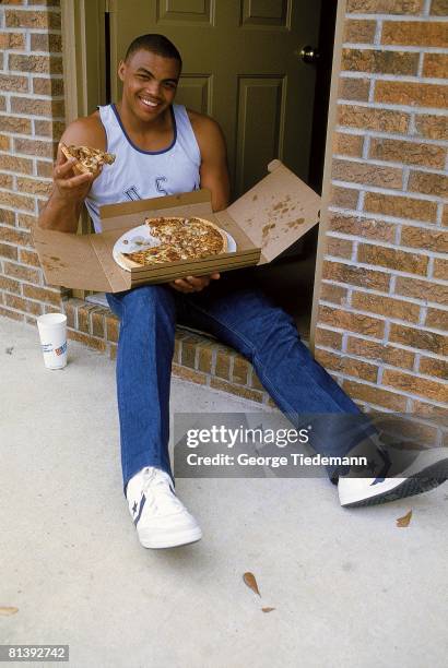 College Basketball: Closeup casual portrait of Auburn Charles Barkley at home eating pizza, Auburn, AL 3/2/1984