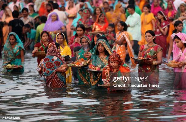 Devotees performing Chhath puja at Dadar chowpatty on Tuesday.