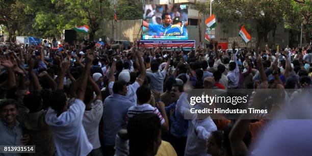 Residents of Dadar celebrates the wicket of Sri lankan batsmen in Shivaji Park as they enjoy World Cup final match between India and Sri Lanka on the...