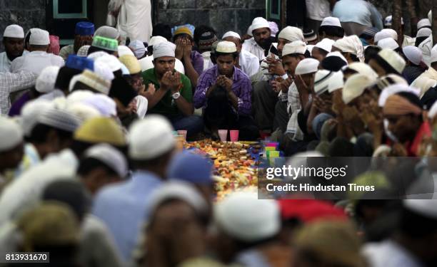 Muslims gather at Pydhonie's Hamidiya Masjid to break the first fast of Ramzan on Tuesday evening -.