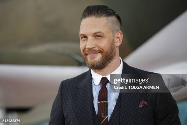 British actor Tom Hardy poses for a photograph upon arrival for the world premiere of "Dunkirk" in London on July 13, 2017. / AFP PHOTO / Tolga AKMEN