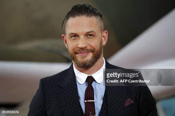 British actor Tom Hardy poses for a photograph upon arrival for the world premiere of "Dunkirk" in London on July 13, 2017. / AFP PHOTO / Tolga AKMEN