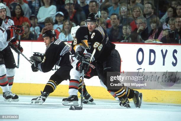 Hockey: playoffs, Pittsburgh Penguins Jaromir Jagr in action during check vs Buffalo Sabres Stu Barnes , Buffalo, NY 5/5/2001