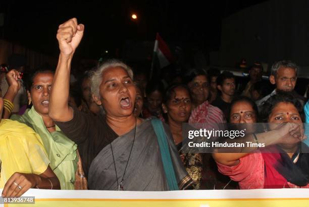 Social activist Medha Patkar and hundreds of her supporters protest at Adarsh Housing Society on Tuesday -.