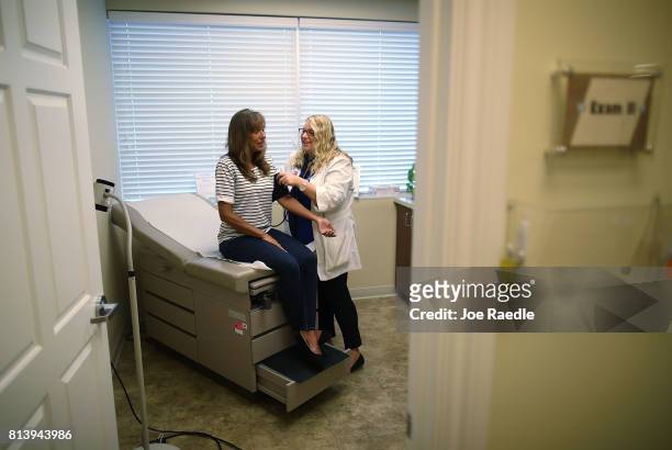 Ginger Rae has her blood pressure checked by registered nurse practitioner Rachel Eisenberg during a checkup at a Planned Parenthood health center on...
