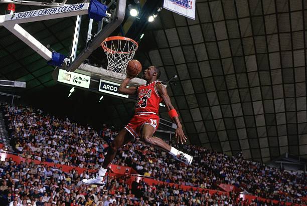 Basketball: NBA Slam Dunk Contest, Chicago Bulls Michael Jordan in action, making dunk during All Star Weekend, Seattle, WA 2/8/1987