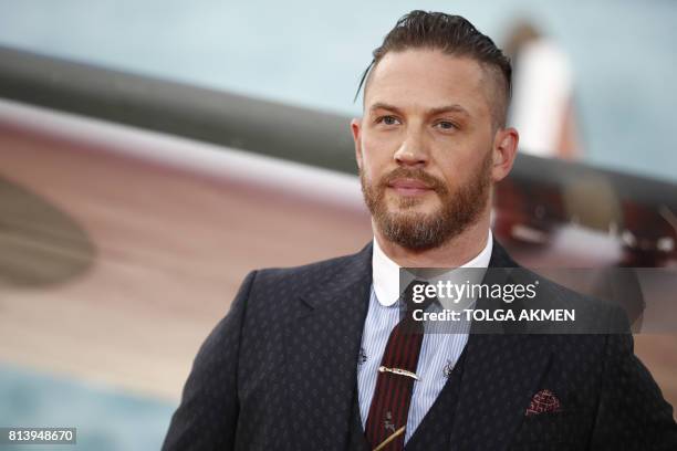 British actor Tom Hardy poses for a photograph upon arrival for the world premiere of "Dunkirk" in London on July 13, 2017. / AFP PHOTO / Tolga AKMEN
