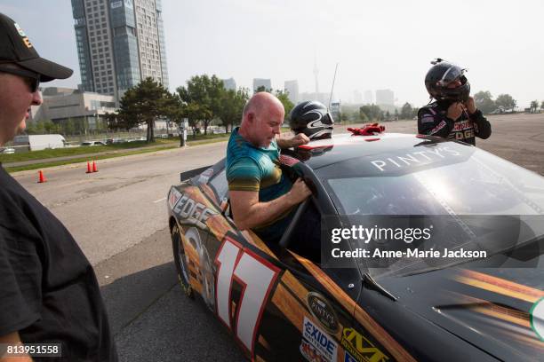 July 12, 2017 - Sports reporter Mark Zwolinski takes a ride in a Castrol Dodge, driven by St. Thomas, Ontario's DJ Kennington, who competed in the...