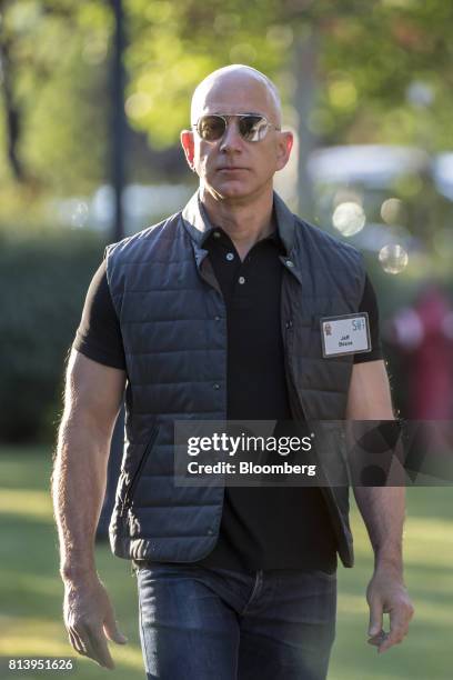 Jeff Bezos, founder and chief executive officer of Amazon.com Inc., arrives for the morning sessions during the Allen & Co. Media and Technology...