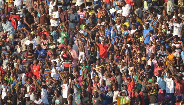 Everton FC supporters cheer prior to a friendly football match between Everton and Kenya's Gor Mahia, at the Dar-es-Salaam stadium, on July 13, 2017....