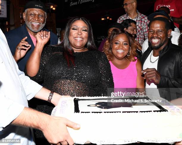 Comedians George Wallace, Loni Love, Sherri Shepherd and Scruncho pose before Loni Love blows out the candles on her cake at the after party at Loni...