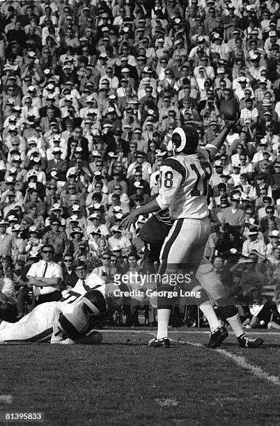 Football: Los Angeles Rams QB Roman Gabriel in action, making pass vs Minnesota Vikings, View of Rams Bob Brown on ground, Los Angeles, CA 12/7/1969