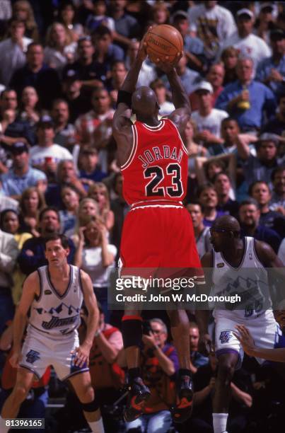 Basketball: NBA Finals, Rear view of Chicago Bulls Michael Jordan in action, making game winning shot vs Utah Jazz, Game 6, Salt Lake City, UT...