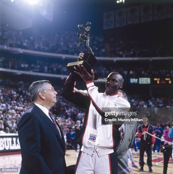 Basketball: NBA Playoffs, Chicago Bulls Michael Jordan victorious with MVP trophy and commissioner David Stern before game vs Cleveland Cavaliers,...