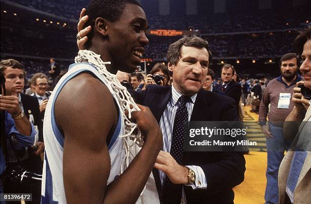 College Basketball: NCAA Final Four, Closeup of North Carolina coach Dean Smith victorious with Jimmy Black after winning championship game vs...