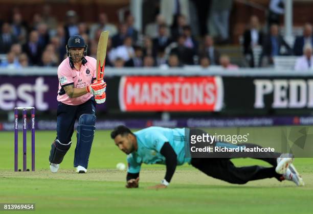 Brendon McCullum of Middlesex hits the ball back past Ravi Rampaul of Surrey during the NatWest T20 Blast match between Middlesex and Surrey at...