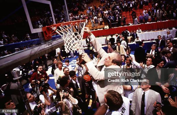 College Basketball: NCAA Final Four, Villanova coach Rollie Massimino victorious, cutting down net after winning championship game vs Georgetown,...