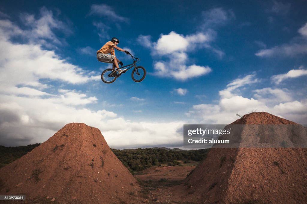 BMX cyclist jumping high. Real jump.