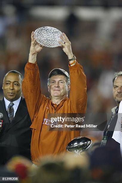 College Football: Rose Bowl, Closeup of Texas coach Mack Brown victorious with trophy after winning BCS Championship game vs USC, Pasadena, CA...