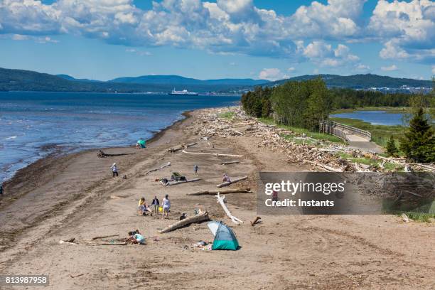 a look at penouille beach in forillon, one of canada’s 42 national parks and park reserves, situated near gaspé, eastern québec. incidental people are present in the image. - gaspe peninsula stock pictures, royalty-free photos & images