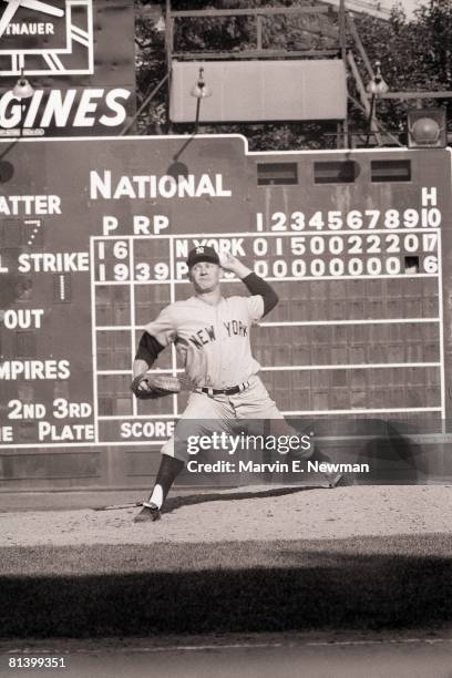 Baseball: World Series, New York Yankees Whitey Ford in action vs Pittsburgh Pirates, View of scoreboard at Forbes Field, stadium, Pittsburgh, PA