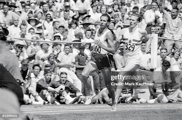 Track & Field: British Empire and Commonwealth Games, Great Britain Roger Bannister in action vs Australia John Landy during mile race, Vancouver,...