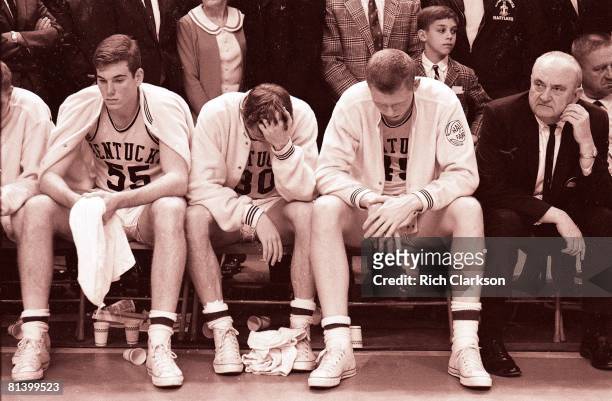 College Basketball: NCAA Final Four, Kentucky Thad Jaracz , Tommy Kron , Cliff Berger , and coach Adolph Rupp upset on bench during awards ceremony...