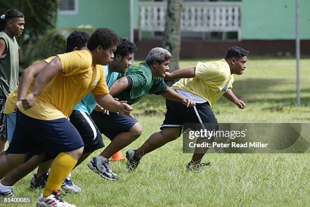 Football: Leone High team in action during practice, Pago Pago, ASM 7/22/2003