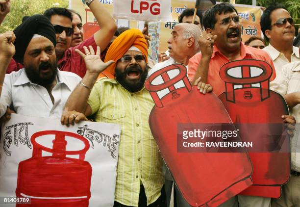 Activists from National Akali Dal shout anti-government and Prime Minister Manmohan Singh slogans during a protest against the government increase in...