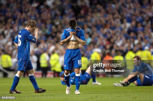 Dejected Glasgow Rangers players including Steven Davis, left and Nacho Novo, centre after the UEFA Cup Final between Zenit St Petersburg and Glasgow...